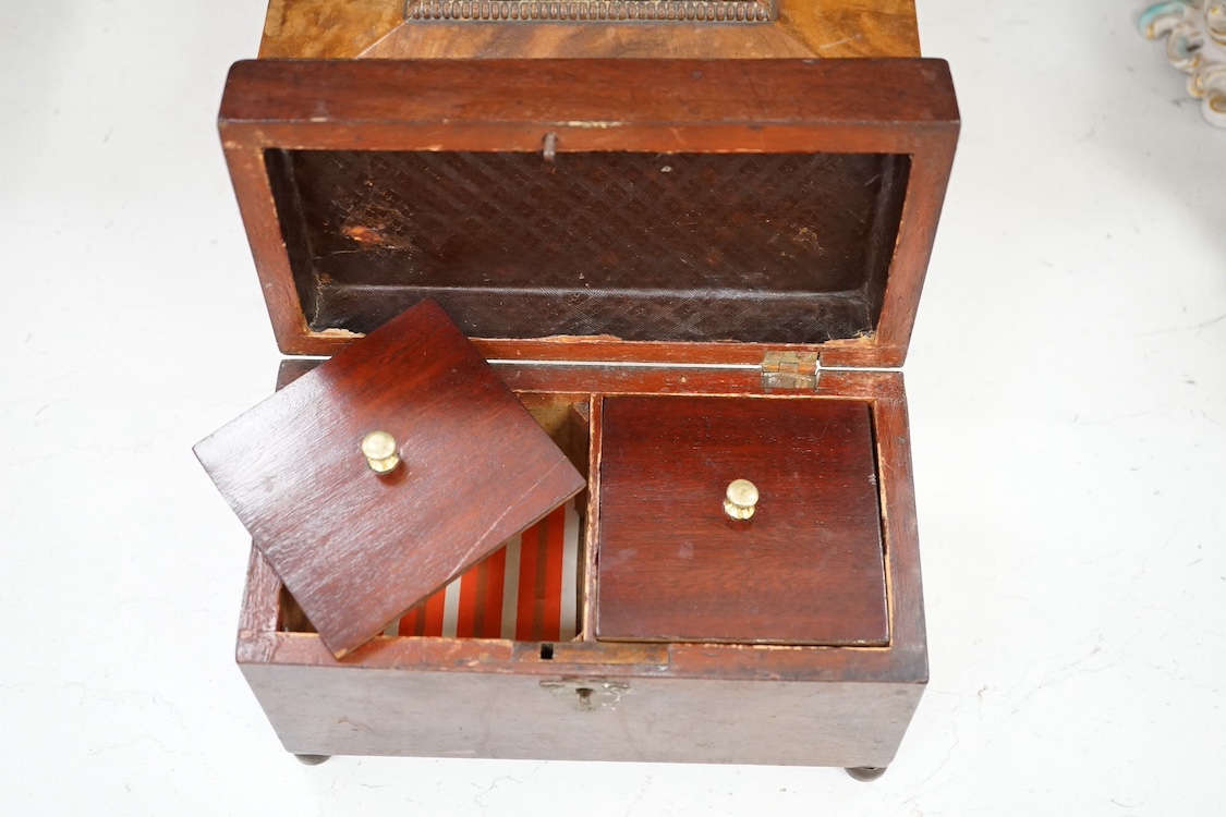 A Victorian walnut lady's toilet box with fitted interior, containing nine bottles, two glass boxes, removable sections, a hidden drawer, etc., together with two mahogany tea caddies. Condition - fair to good.